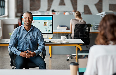 Buy stock photo Portrait of a confident young businessman working in an office