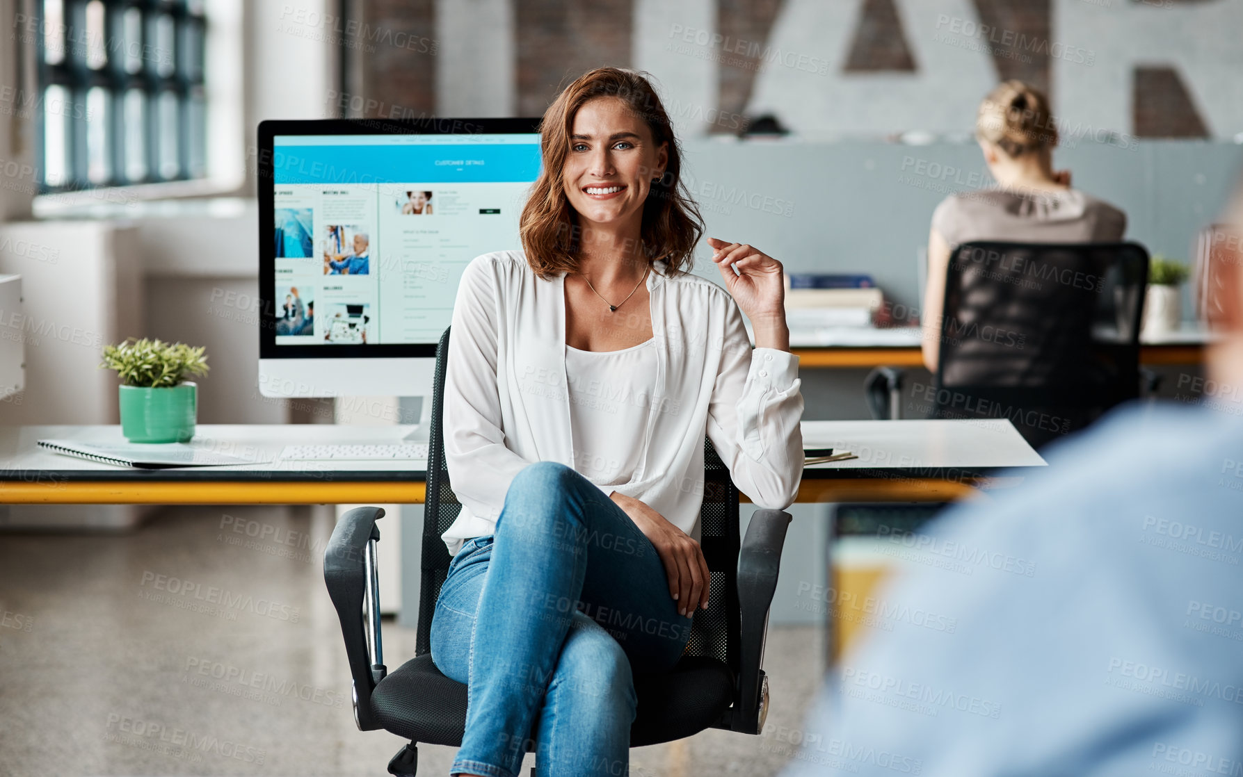 Buy stock photo Portrait of a confident young businesswoman working in an office