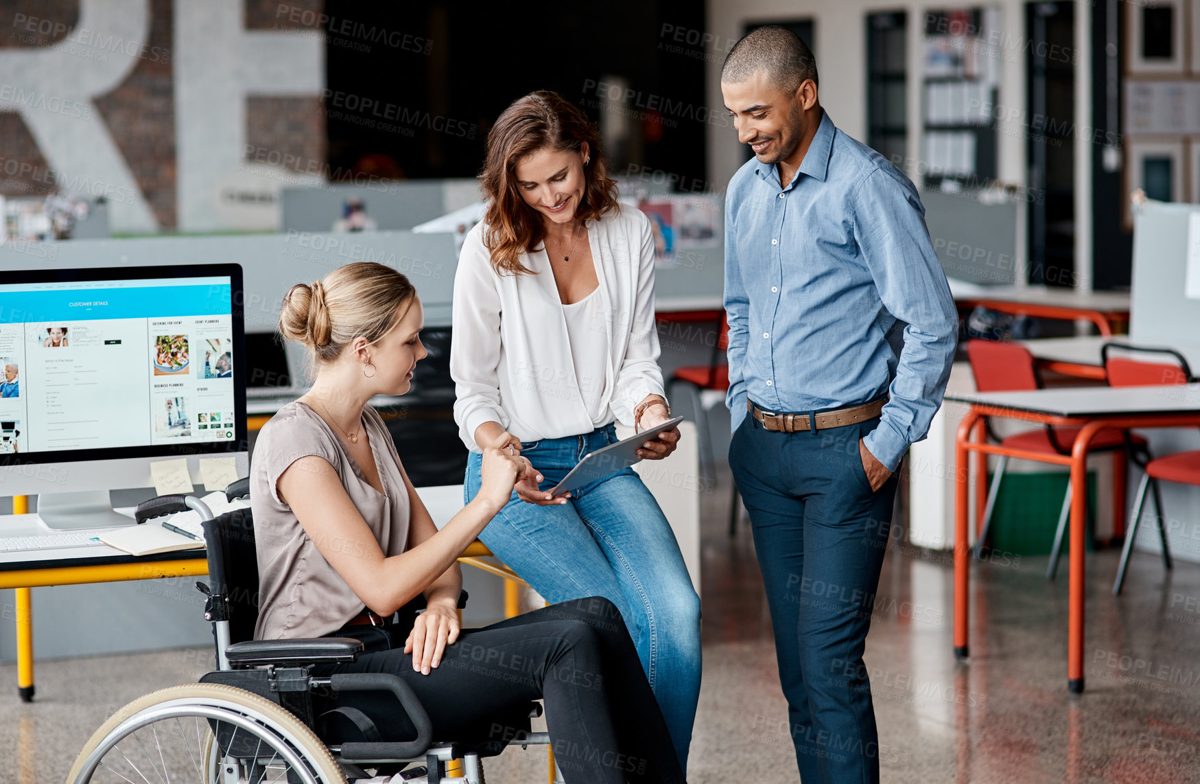 Buy stock photo Shot of a group of businesspeople using a digital tablet together in an office