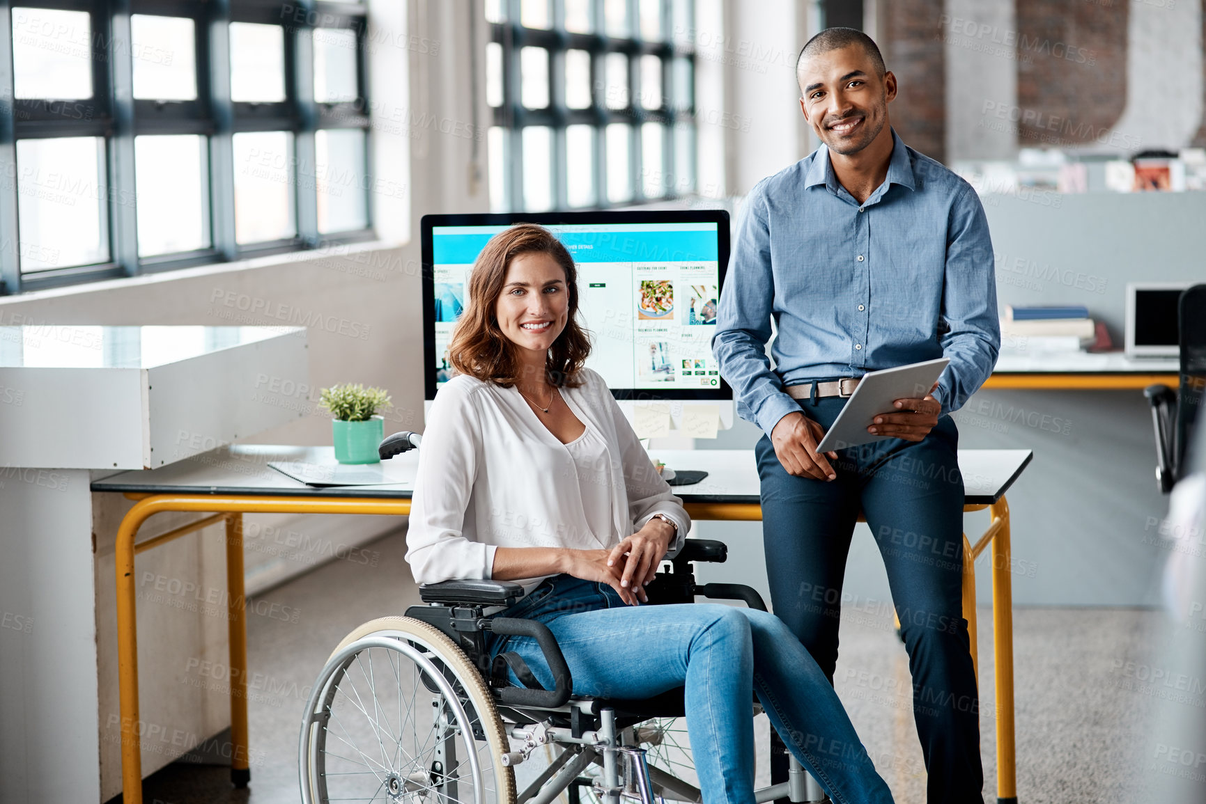 Buy stock photo Portrait of two businesspeople working together in an office