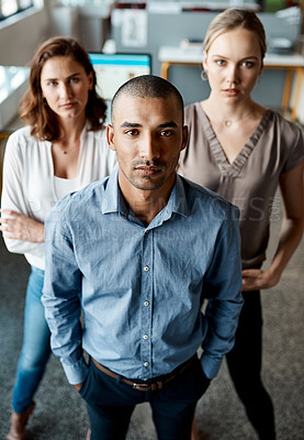 Buy stock photo Shot of a diverse group of businesspeople standing together in the office during the day
