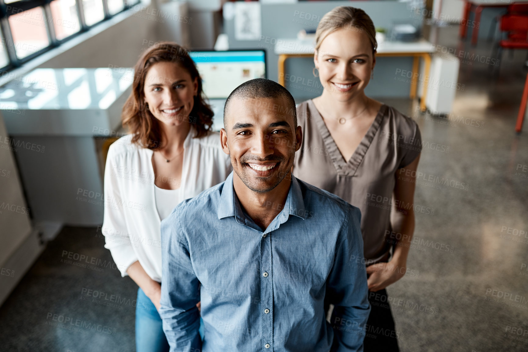 Buy stock photo Shot of a diverse group of businesspeople standing together in the office during the day