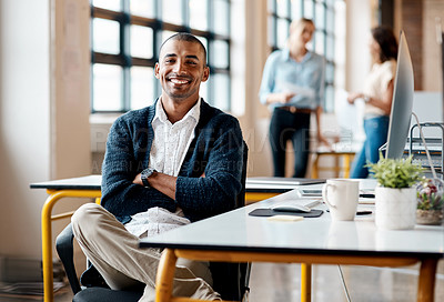 Buy stock photo Portrait of a confident young businessman working in an office