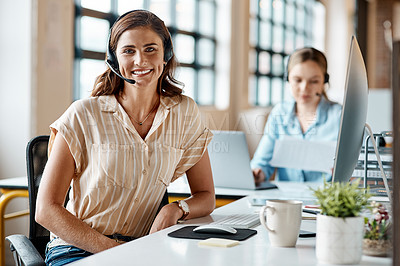 Buy stock photo Portrait of a young businesswoman wearing a headset while working in an office