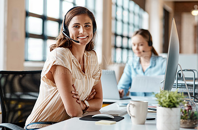 Buy stock photo Portrait of a young businesswoman wearing a headset while working in an office