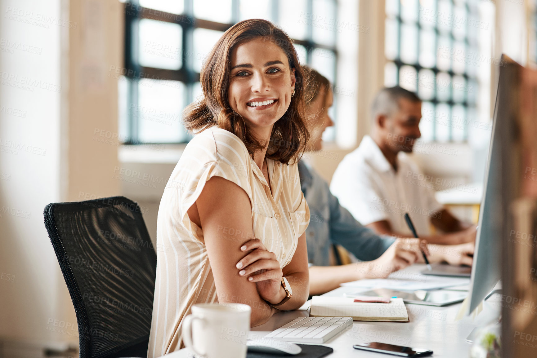 Buy stock photo Portrait of a confident young businesswoman working in an office