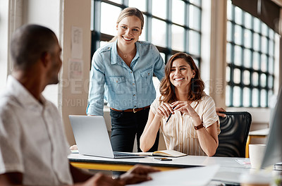 Buy stock photo Shot of a group of businesspeople working together in an office