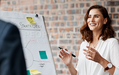 Buy stock photo Shot of a young businesswoman presenting notes on a whiteboard in an office