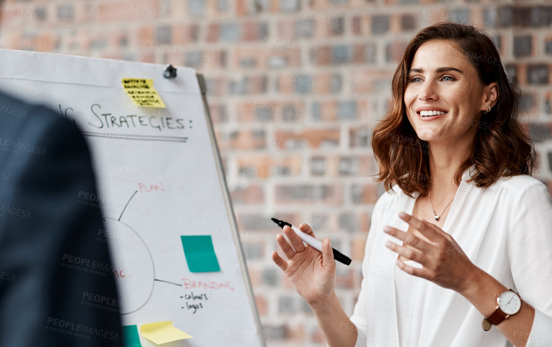 Buy stock photo Shot of a young businesswoman presenting notes on a whiteboard in an office
