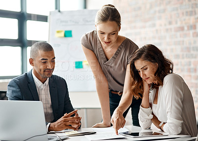 Buy stock photo Shot of a group of businesspeople having a meeting in an office