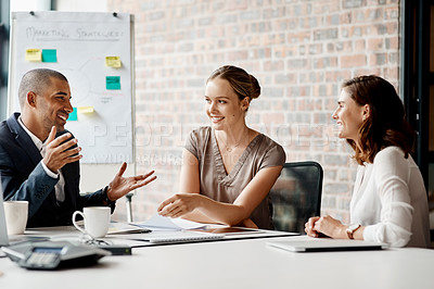 Buy stock photo Shot of a group of businesspeople having a meeting in an office