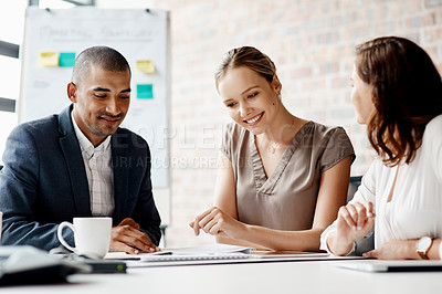 Buy stock photo Shot of a group of businesspeople having a meeting in an office