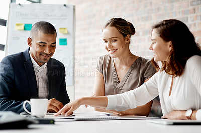 Buy stock photo Shot of a group of businesspeople having a meeting in an office