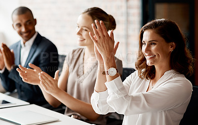 Buy stock photo Shot of a group of businesspeople applauding during a meeting in an office