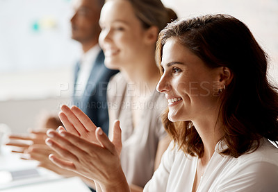 Buy stock photo Shot of a group of businesspeople applauding during a meeting in an office