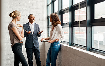 Buy stock photo Shot of a group of businesspeople having a discussion in an office