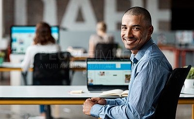 Buy stock photo Portrait of a confident young businessman working in an office