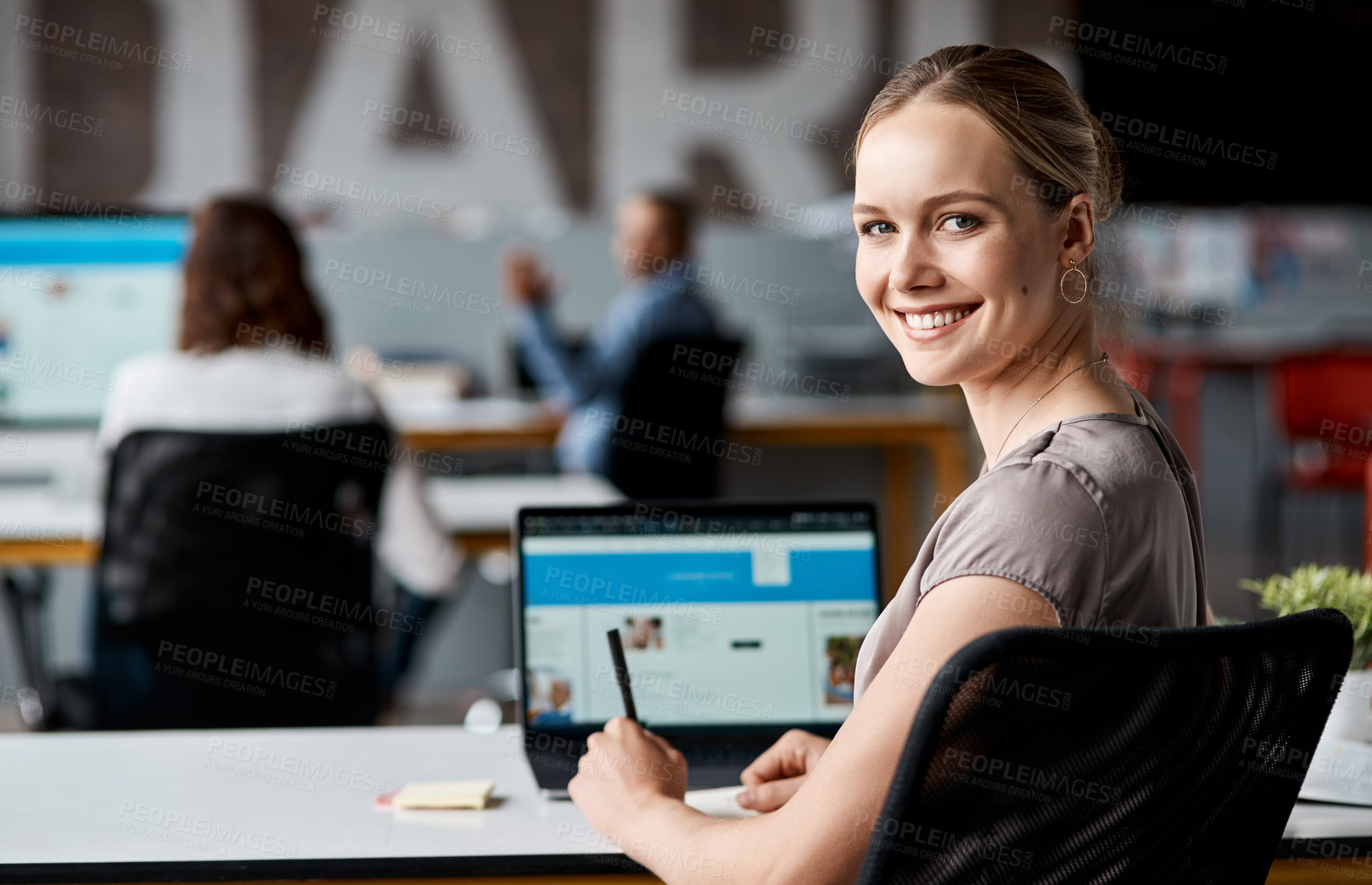 Buy stock photo Portrait of a confident young businesswoman working in an office