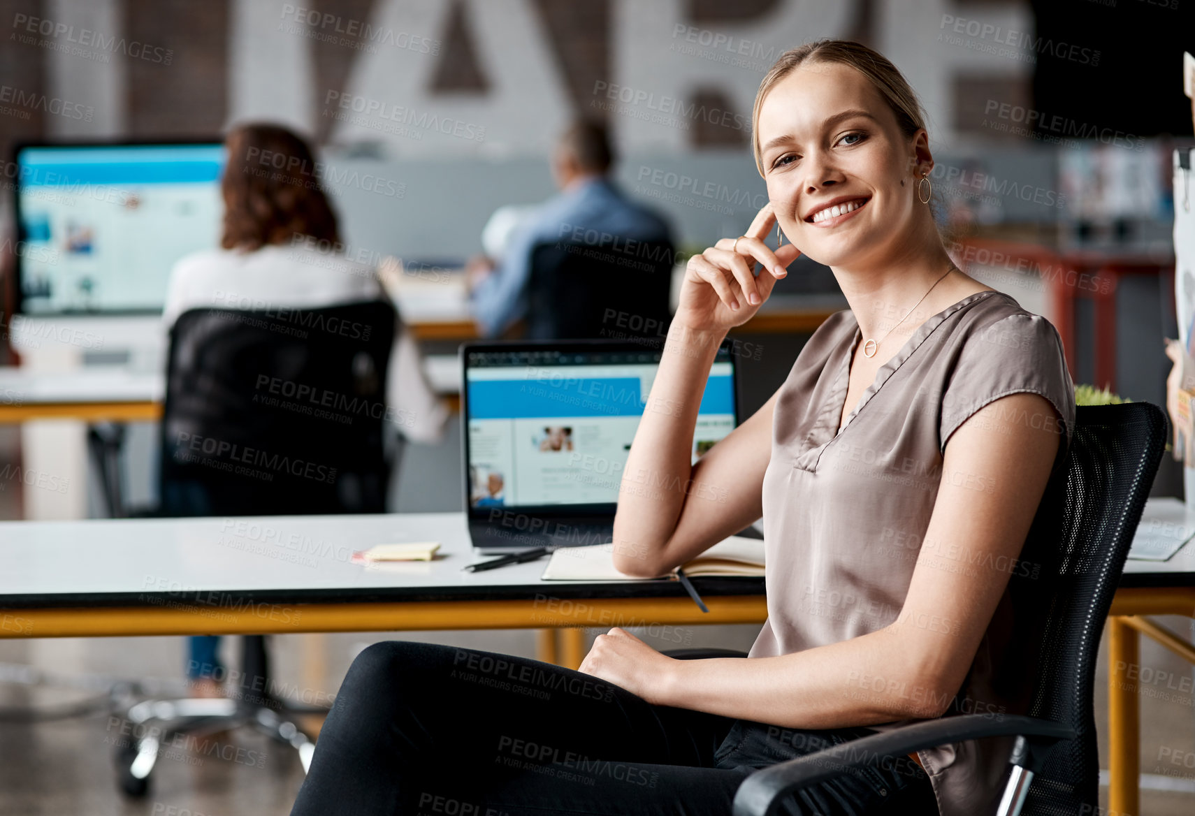 Buy stock photo Portrait of a confident young businesswoman working in an office