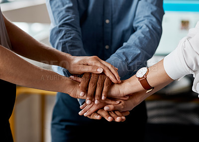 Buy stock photo Closeup shot of a group of unrecognisable businesspeople joining their hands together in a huddle