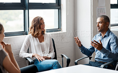 Buy stock photo Shot of a group of businesspeople having a discussion in an office