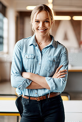 Buy stock photo Portrait of a confident young businesswoman working in a modern office