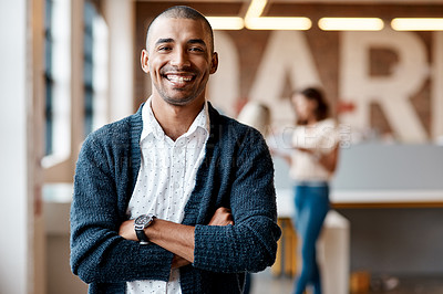 Buy stock photo Portrait of a confident young businessman working in a modern office