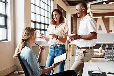 Buy stock photo Shot of a group of young businesspeople having a meeting in a modern office