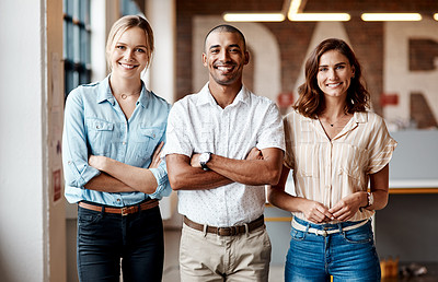 Buy stock photo Portrait of a group of confident young businesspeople working together in a modern office
