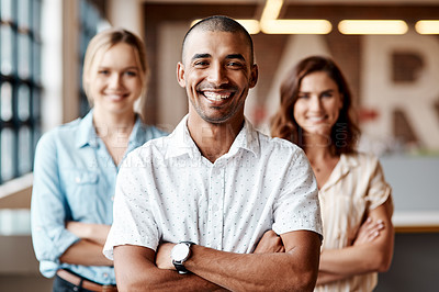 Buy stock photo Portrait of a group of confident young businesspeople working together in a modern office