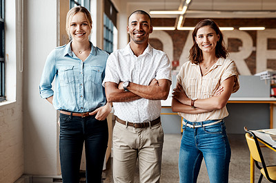 Buy stock photo Portrait of a group of confident young businesspeople working together in a modern office
