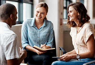 Buy stock photo Shot of a group of young businesspeople having a meeting in a modern office