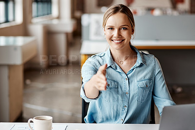 Buy stock photo Shot of a young businesswoman reaching out for a handshake in a modern office