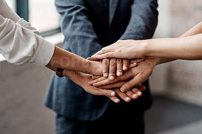 Buy stock photo Closeup shot of a group of unrecognisable businesspeople joining their hands together in a huddle