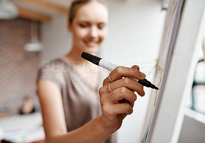 Buy stock photo Closeup shot of a businesswoman writing notes on a whiteboard in an office