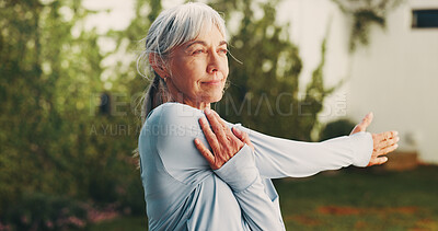Buy stock photo Backyard, wellness and senior woman stretching for functional fitness, shoulder mobility or exercise. Active, pensioner or arm warm up at house for retirement health, physical activity or flexibility