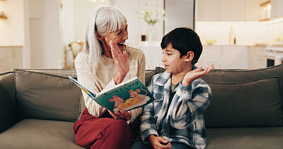 Buy stock photo Book, grandmother or child with high five on sofa for literacy milestone, learning support or care. Family, boy or senior woman with celebration in home for reading goal, language development or love