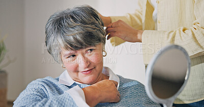 Buy stock photo Haircare, senior mother or woman in house with mirror, grooming or family bonding in morning routine. Smile, elderly mom or daughter with tool, getting ready or hair styling assistance in retirement.