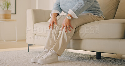 Buy stock photo Hands, old person or knee pain in home, arthritis and injury with muscle tension in living room. Sore legs, retirement or woman on sofa with gout, osteoporosis or tendinitis from health problem