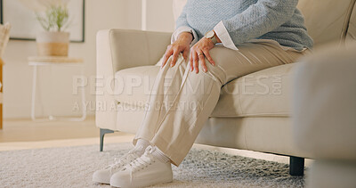 Buy stock photo Hands, old person or knee pain in home, injury and arthritis with muscle tension in living room. Sore legs, retirement or woman on sofa with gout, osteoporosis or tendinitis from health problem
