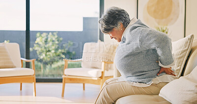 Buy stock photo Elderly, woman or back pain on sofa, injury or fibromyalgia with osteoporosis in living room. Discomfort, retirement or person with sore spine at home, arthritis or muscle tension with health problem