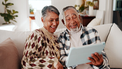 Buy stock photo Laughing, reading and senior couple with tablet in lounge, connection or article on social media app. Retirement, home and happy people with technology in living room, entertainment and funny news