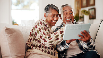 Buy stock photo Laughing, online and senior couple with tablet in lounge, bonding or reading article on social media. Retirement, home and happy people with technology in living room, entertainment and funny news