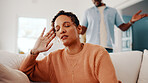 Upset, fight and woman with partner in home for argument, disagreement or separation. Disappointed, couple or female person with stress or ignore for toxic relationship, dispute or conflict in house