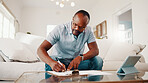 Finance, documents and black man writing in home for budget planning, expenses or report. Male person, tablet or paperwork with clipboard on sofa for financial assessment, bills or tax deductions