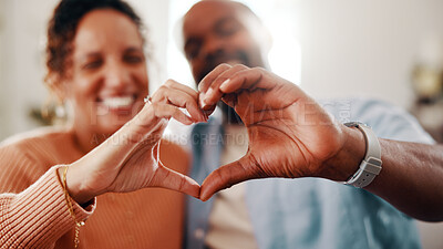 Buy stock photo Happy, couple or home with heart hands for love, romance or anniversary date together. Man, woman or relationship with smile, partner or shape for romantic gesture, valentines day or support in house