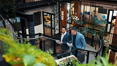 Buy stock photo Above, manager and man with tablet on steps for financial forecasting with market research in office. Economist, advice and collaboration for business strategy, chat and people with tech on stairs
