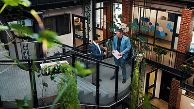Buy stock photo Above, manager and man with tablet on stairs for financial planning with market research in office. Economist, advice and collaboration for business strategy, chat and people with tech on steps