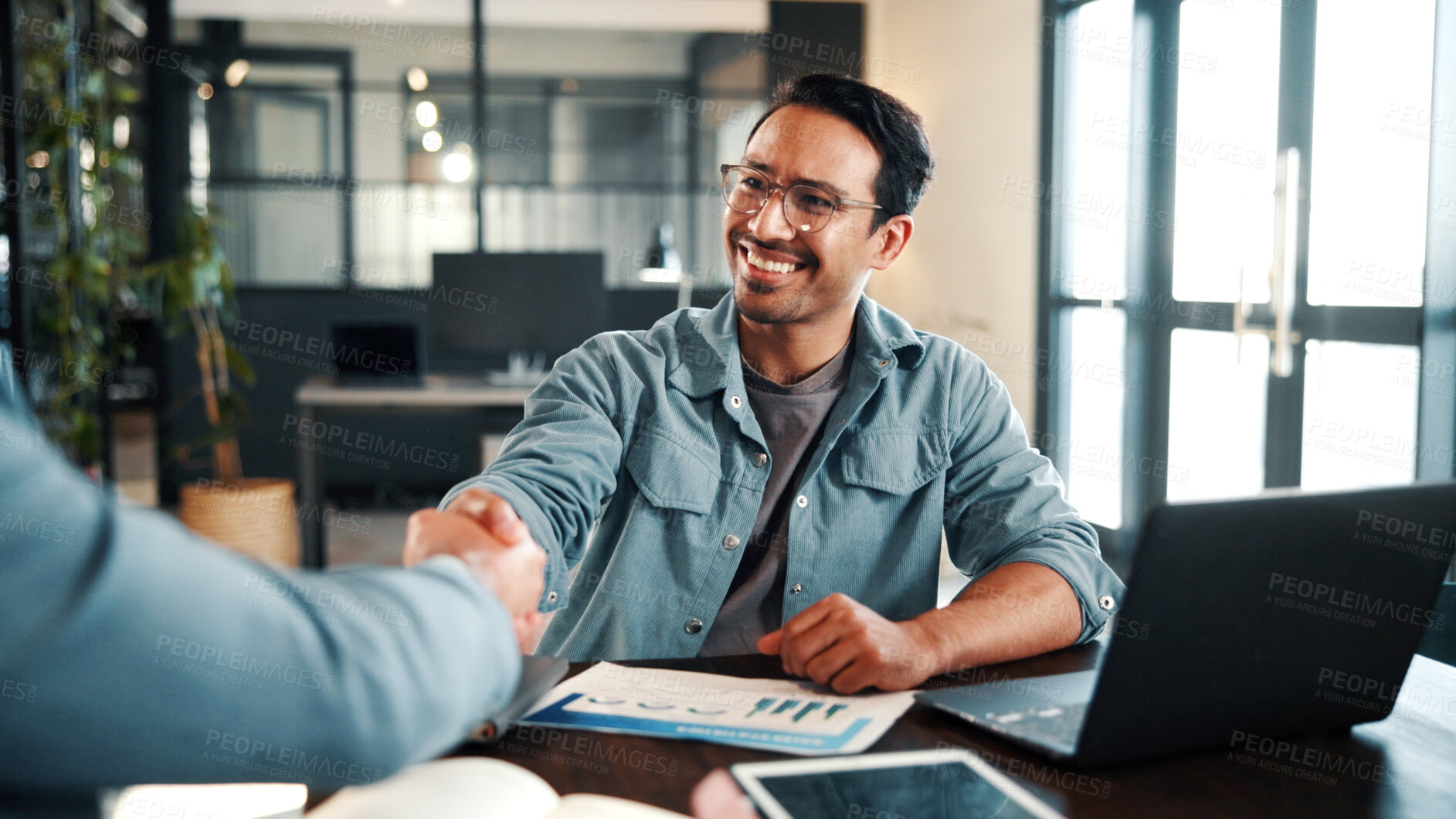 Buy stock photo Handshake, meeting and business people with document for review, planning and graphs. Office, shaking hands and man with laptop for welcome, b2b budget and collaboration for proposal or negotiation