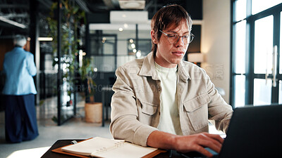 Buy stock photo Creative, typing and man with laptop in office, graphic designer and planning for project with info. Serious, employee and person with glasses, assignment and design research with tech in business